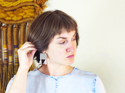 Iris Earrings in ear