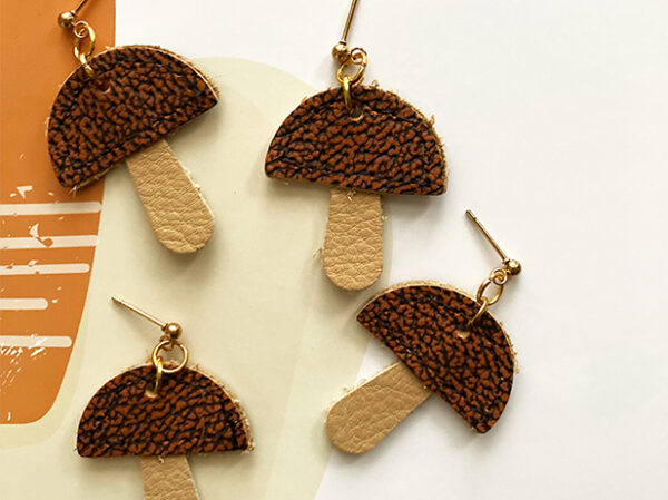 TWL leather mushie earrings with brown top and cream stem