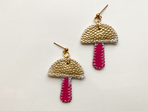 TWL vegan-friendly mushie earrings with cream top and pink stem